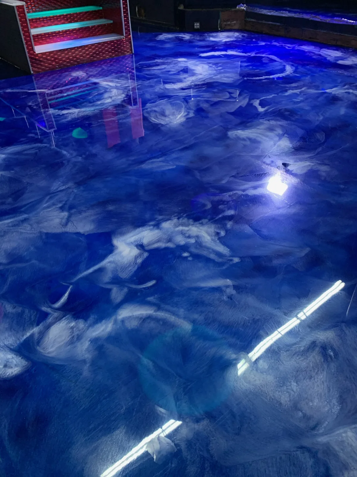 Ocean-blue metallic epoxy floor