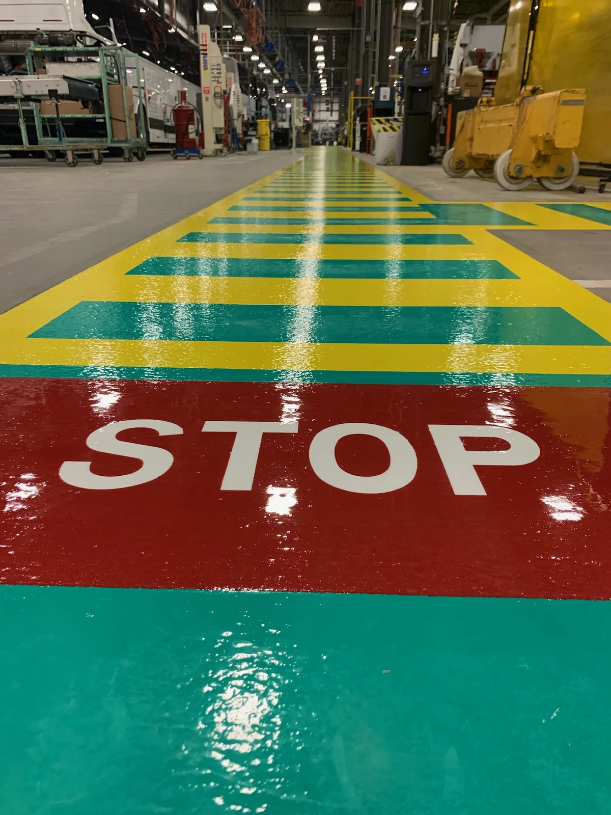 Quartz epoxy factory walkway with painted safety striping