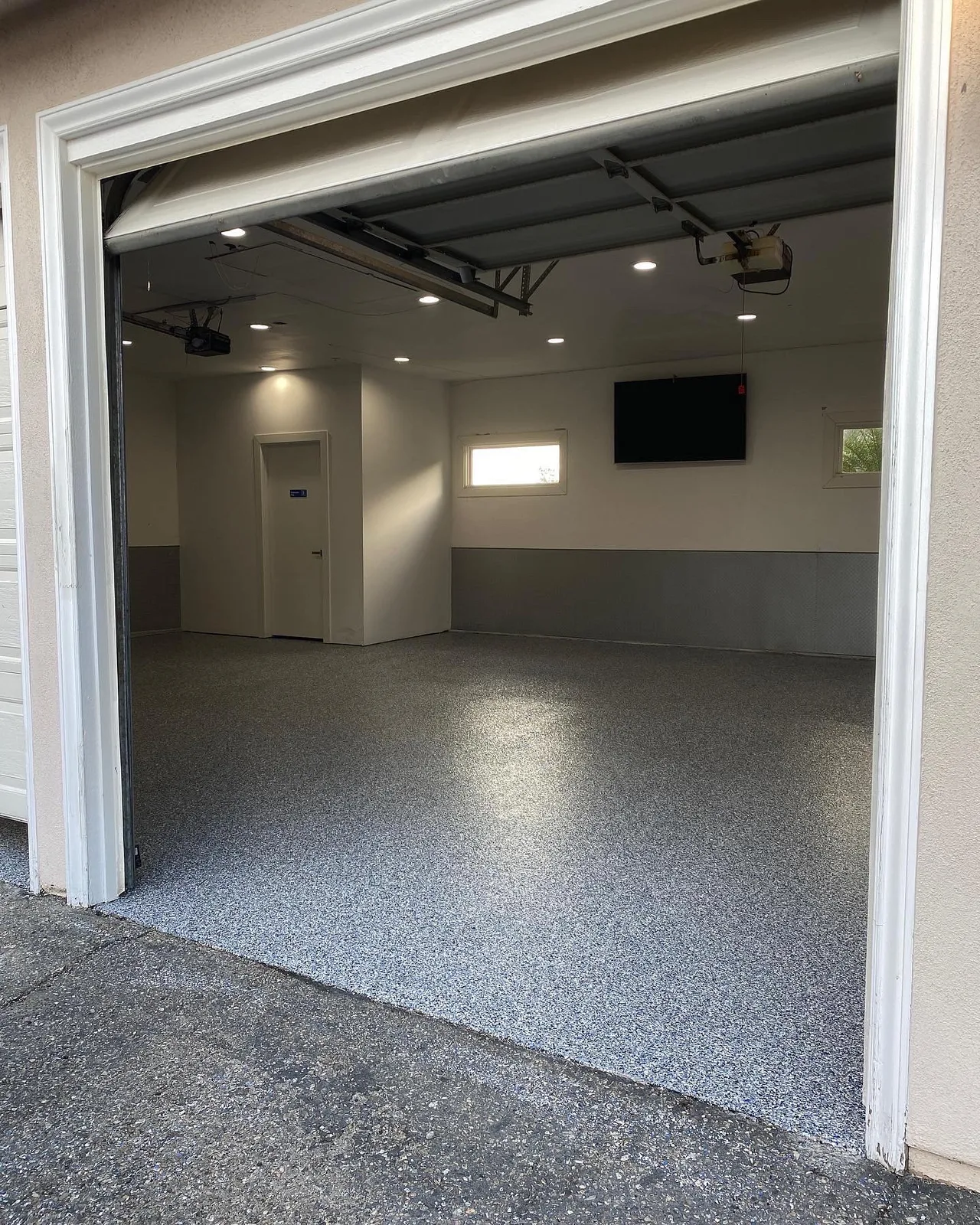 Gray flake epoxy floor in a finished two-car garage