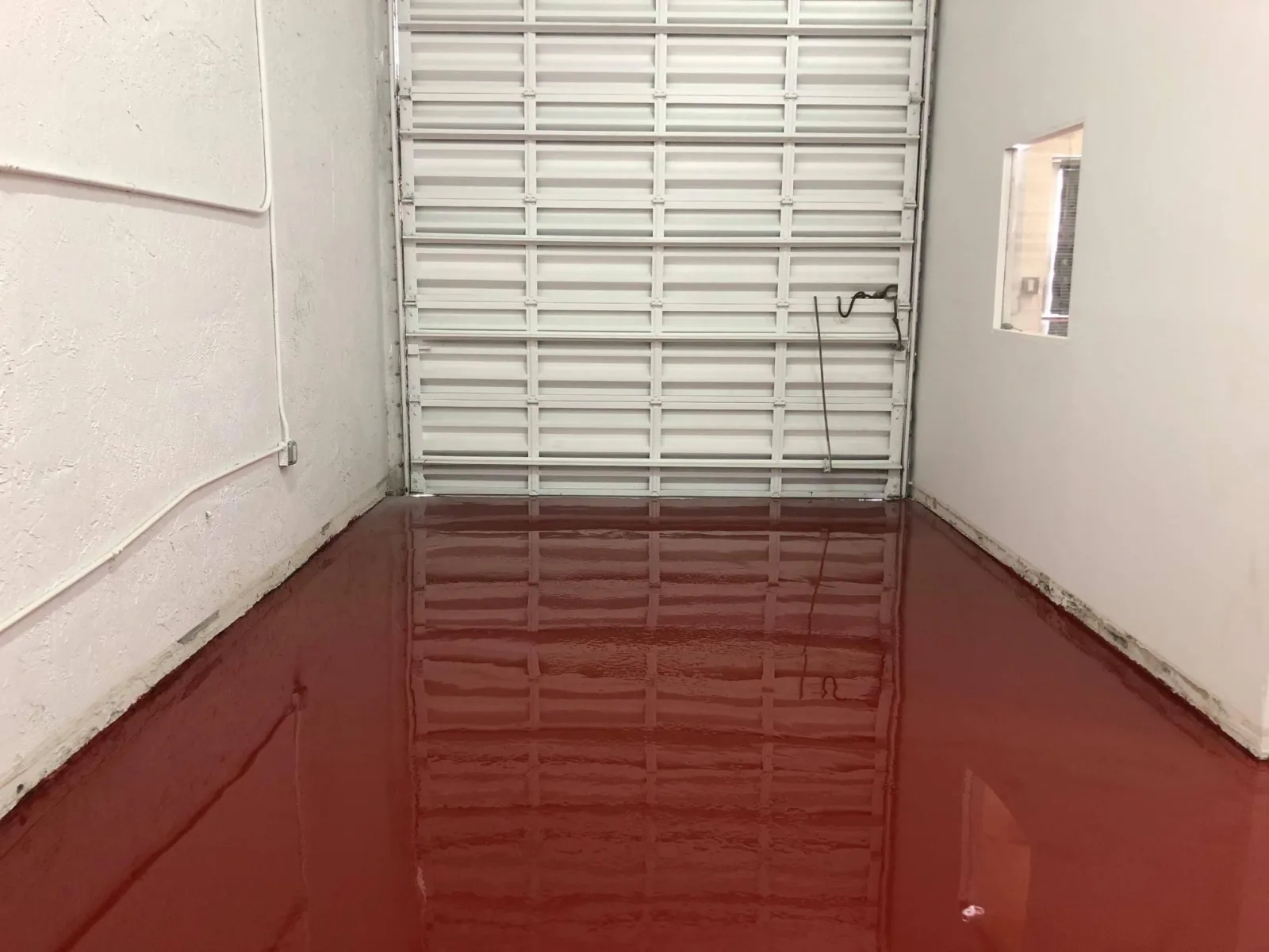 Glossy red solid color epoxy garage floor