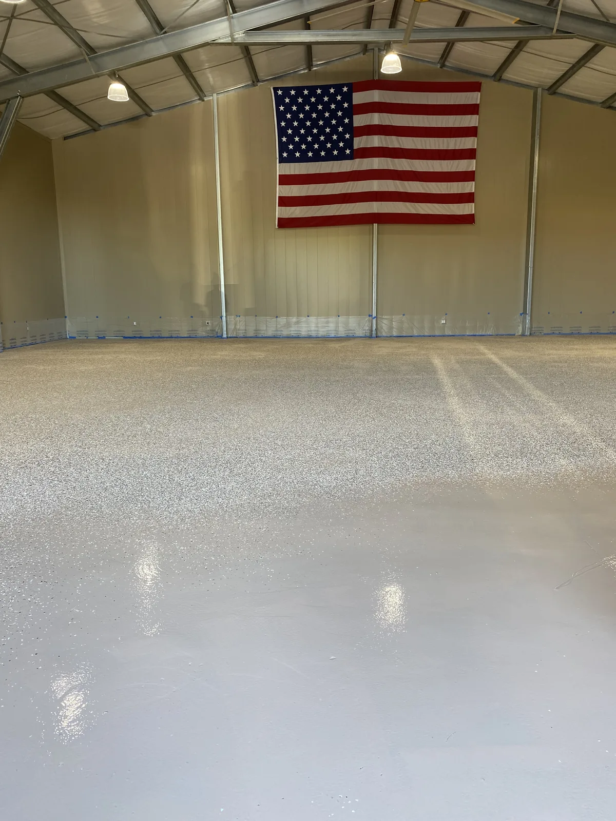 Flake epoxy being installed in a Los Angeles warehouse